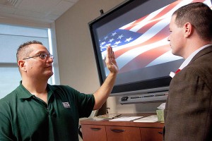 Diego F. Hernandez, PsyD (left), a licensed clinical psychologist, demonstrates Accelerated Resolution Therapy, as veteran Brian Anderson follows his hand movements. (Credit: University of South Florida)